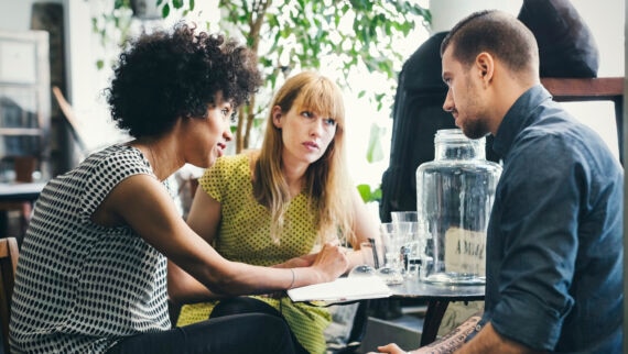 A group of people sitting at a table