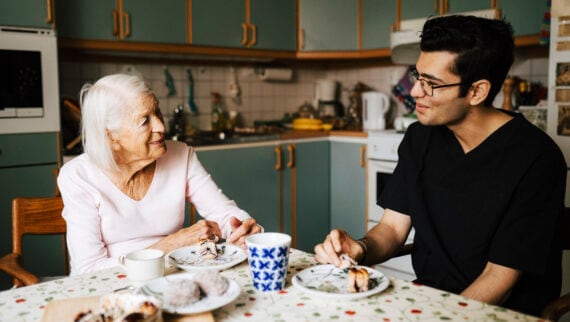 Support workers caring for an elderly family member