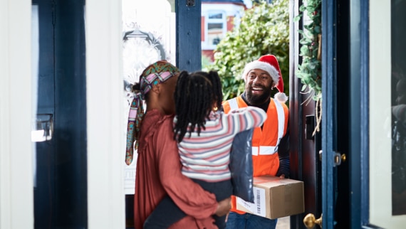 A seasonal worker delivering a parcel