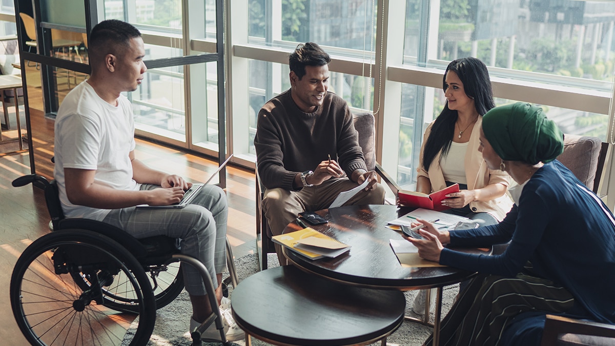 Four colleagues having a meeting in the office