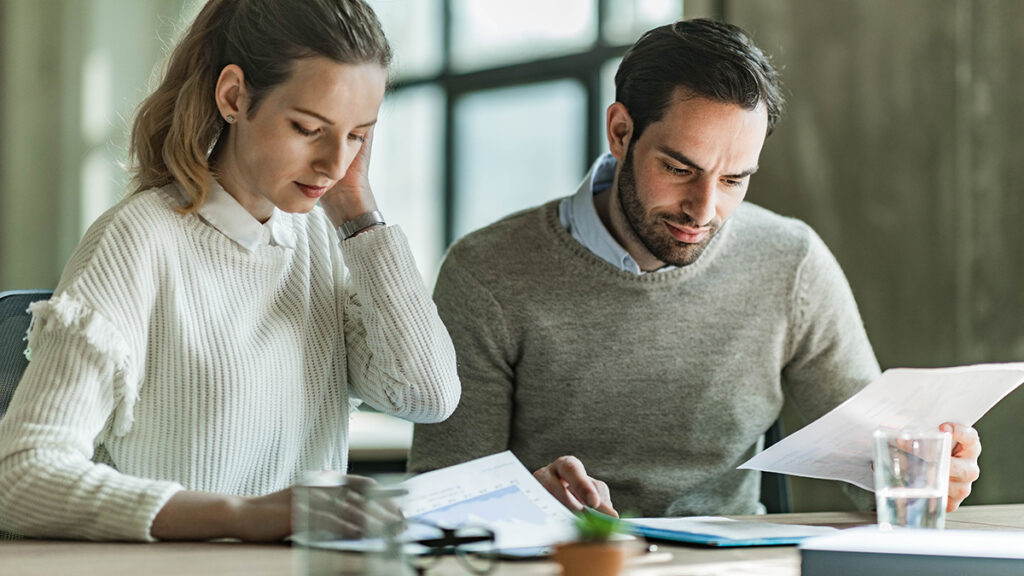 Two colleagues conducting the salary review process