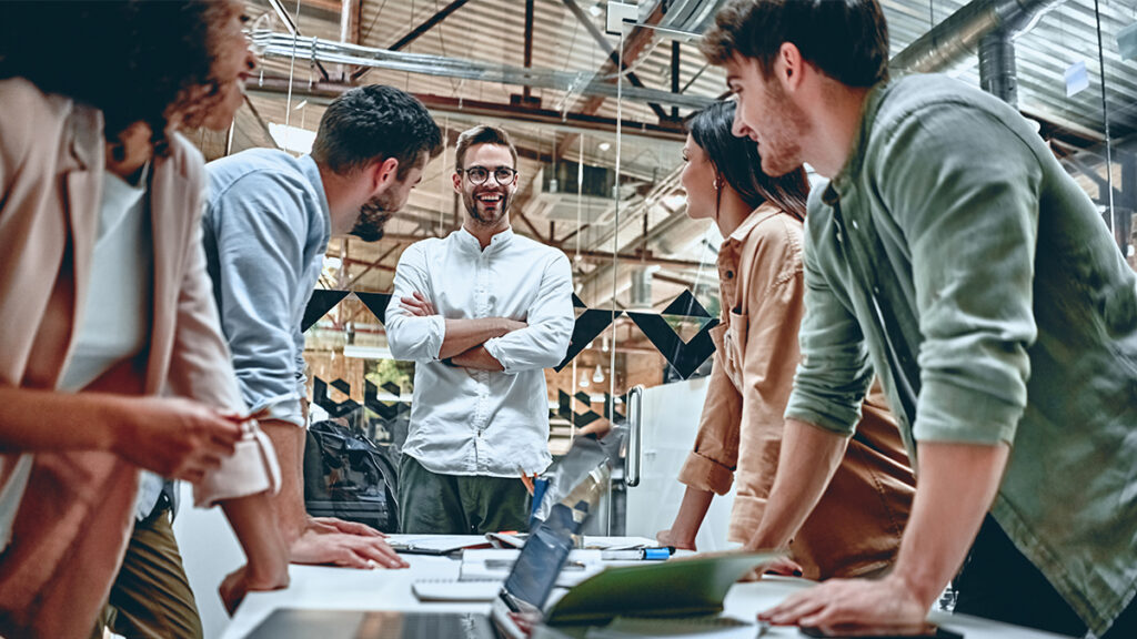 A group of work colleagues in a meeting with a senior manager