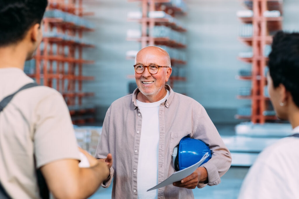 A worker over 50 meeting new colleagues