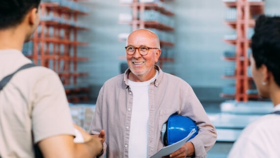 A worker over 50 meeting new colleagues
