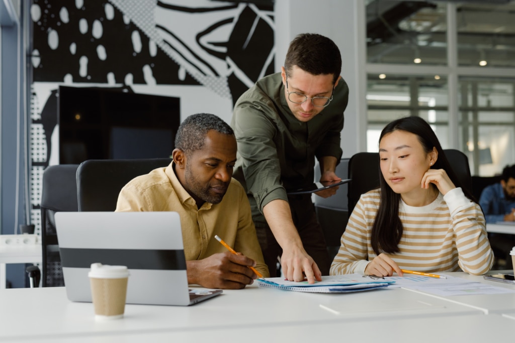 A team of recruiters comparing notes