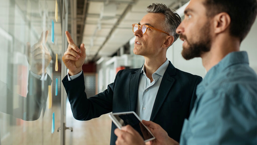 Two colleagues working on implementing a succession plan