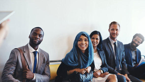 An image of a group of candidates awaiting an interview.