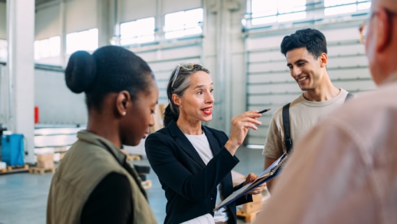 An age diverse group of employees discussing plans