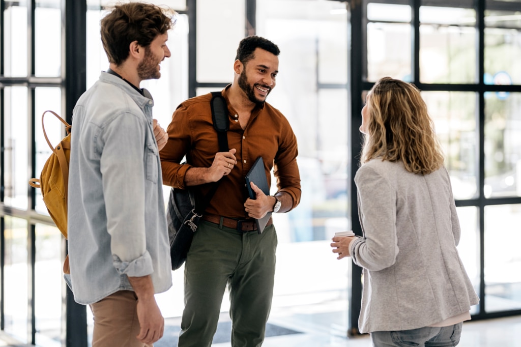 Employees saying goodbye at the end of the offboarding process