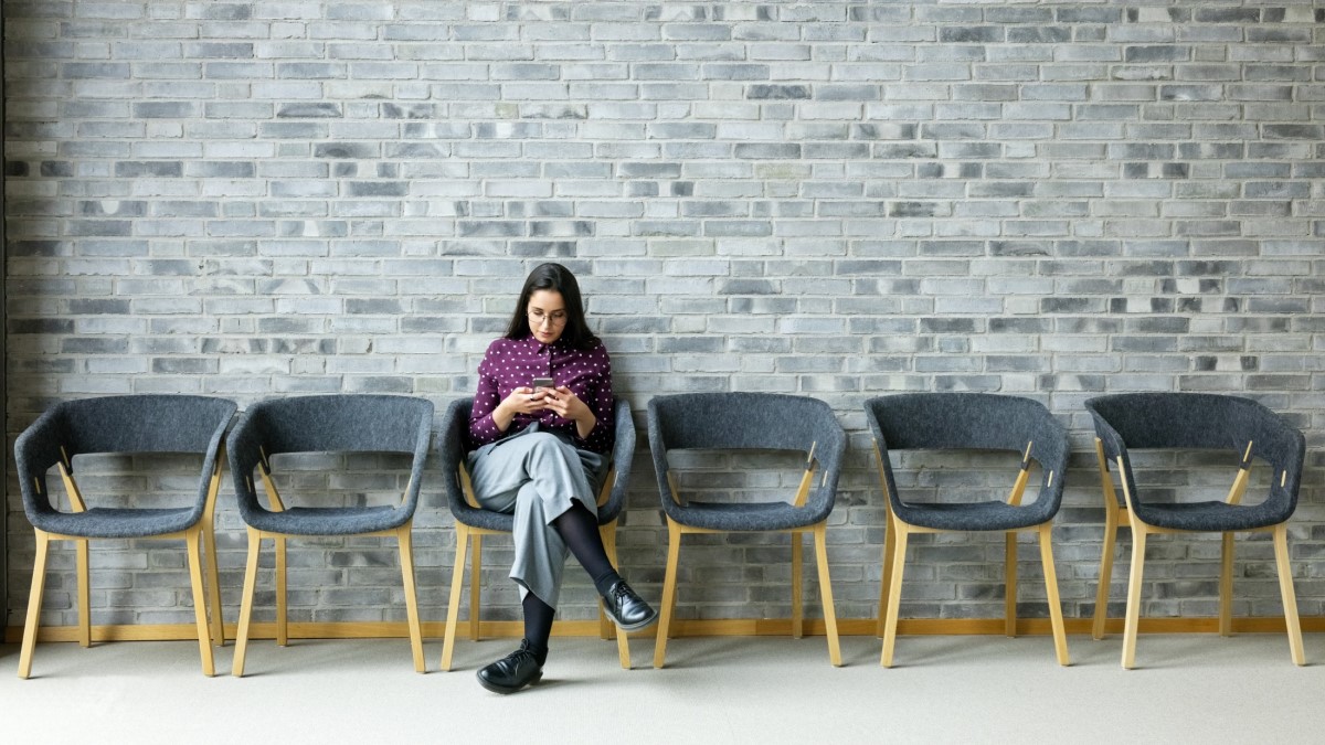 woman sitting in the waiting room by herself