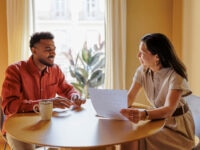 Professionals reviewing contract terms during a productive meeting in a workspace