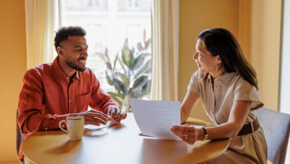 Professionals reviewing contract terms during a productive meeting in a workspace