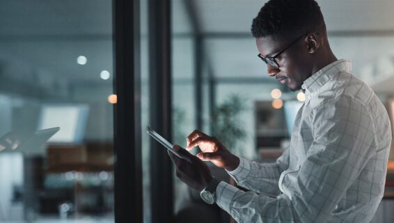 A professional man in the office using technology, suggesting the importance of AI in recruitment