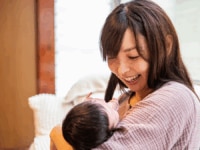 A mother on maternity leave with her child