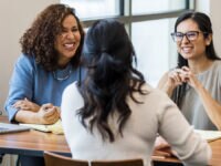 Two interviewers asking a candidate competency interview questions