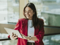 Recruiter looks at a tablet in an office