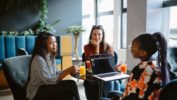 Group of female colleagues having a meeting over breakfast