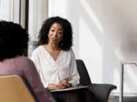 A manager conducting a return to work interview with an employee