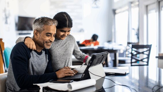 An employee working at home with his daughter