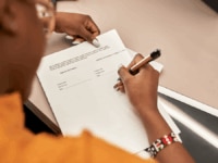 A worker reviewing their contract of employment