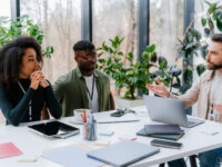 People discussing market trends in an office