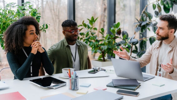 People discussing market trends in an office