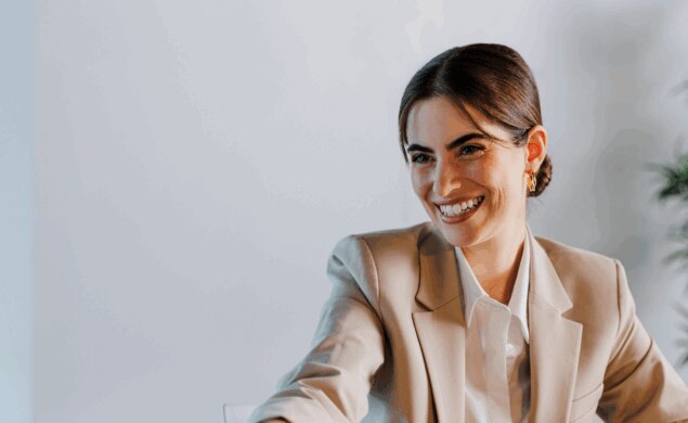 A woman shaking hands following successful salary negotiations