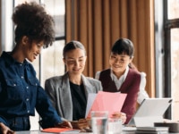 Colleagues reviewing data together—reflecting collaboration and analysis behind the latest UK industry salary and benefit trends shaping 2025 recruitment strategies