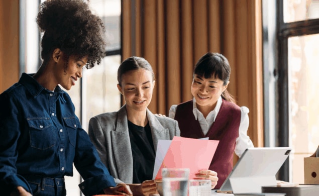 Colleagues reviewing data together—reflecting collaboration and analysis behind the latest UK industry salary and benefit trends shaping 2025 recruitment strategies