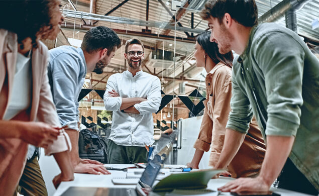 A group of work colleagues in a meeting with a senior manager