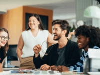 Young people having a meeting in an office