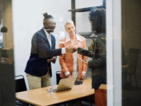 Colleagues shaking hands with an interview candidate
