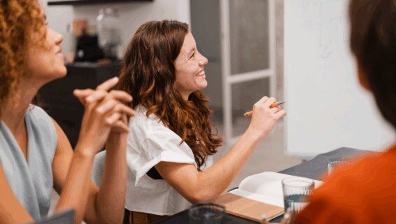 Happy and engaged colleagues conducting a business meeting in an office environment
