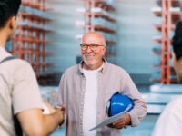 A worker over 50 meeting new colleagues