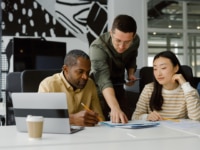 A team of recruiters comparing notes
