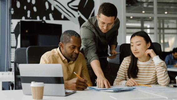 A team of recruiters comparing notes