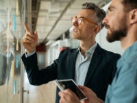 Two colleagues working on implementing a succession plan
