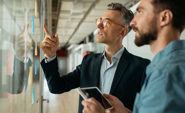 Two colleagues working on implementing a succession plan