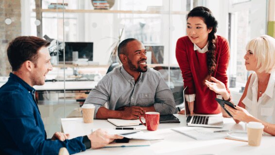Business meeting where happy employees are discussing their growth strategy