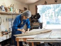 An older employee in a workshop