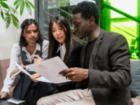 A team of recruiters analysing data in an office setting