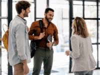 Employees saying goodbye at the end of the offboarding process