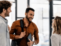 Employees saying goodbye at the end of the offboarding process