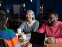 3 work colleagues discussing a project